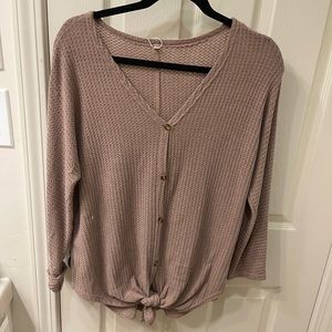 Oversized lightweight button up sweater with tie at bottom.